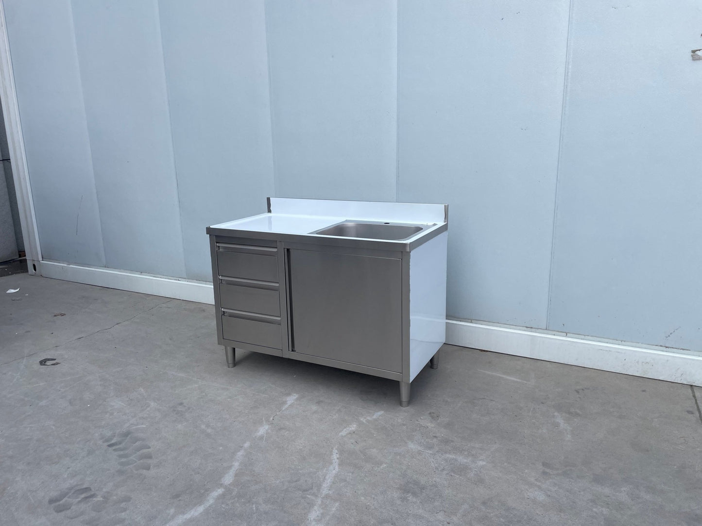 Stainless steel utility sink with 3 drawers front view

Commercial sink cabinet for restaurant or kitchen use

Stainless sink station with pull-out storage drawers

Industrial-grade sink unit with integrated storage

Compact kitchen sink workstation for food prep areas