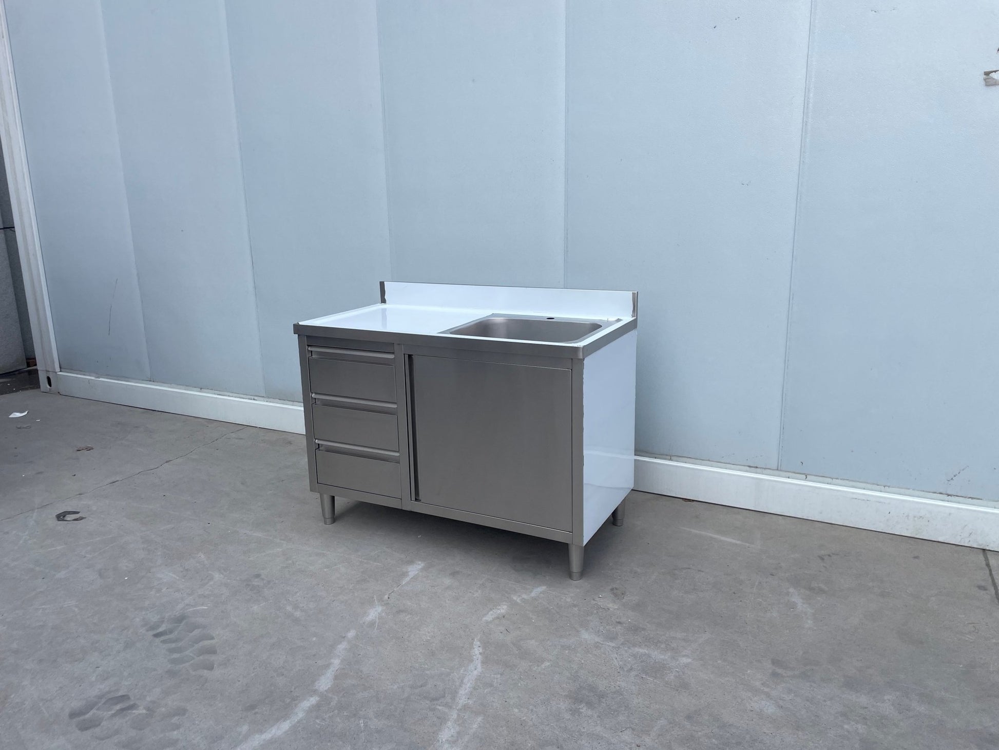 Stainless steel utility sink with 3 drawers front view

Commercial sink cabinet for restaurant or kitchen use

Stainless sink station with pull-out storage drawers

Industrial-grade sink unit with integrated storage

Compact kitchen sink workstation for food prep areas