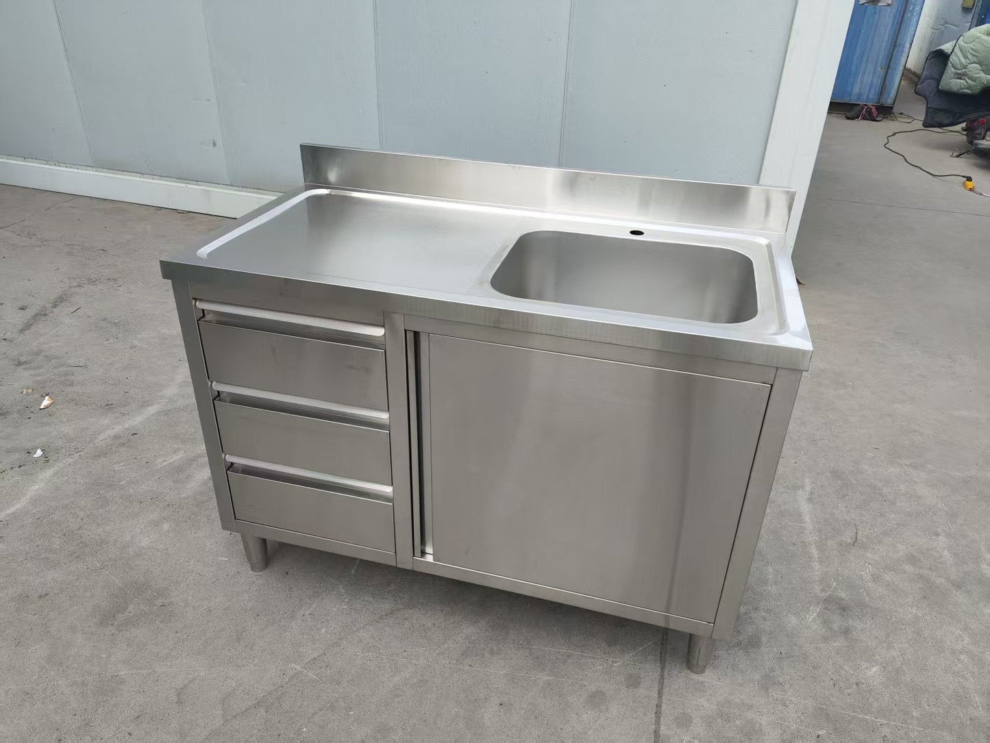 Stainless steel utility sink with 3 drawers front view

Commercial sink cabinet for restaurant or kitchen use

Stainless sink station with pull-out storage drawers

Industrial-grade sink unit with integrated storage

Compact kitchen sink workstation for food prep areas