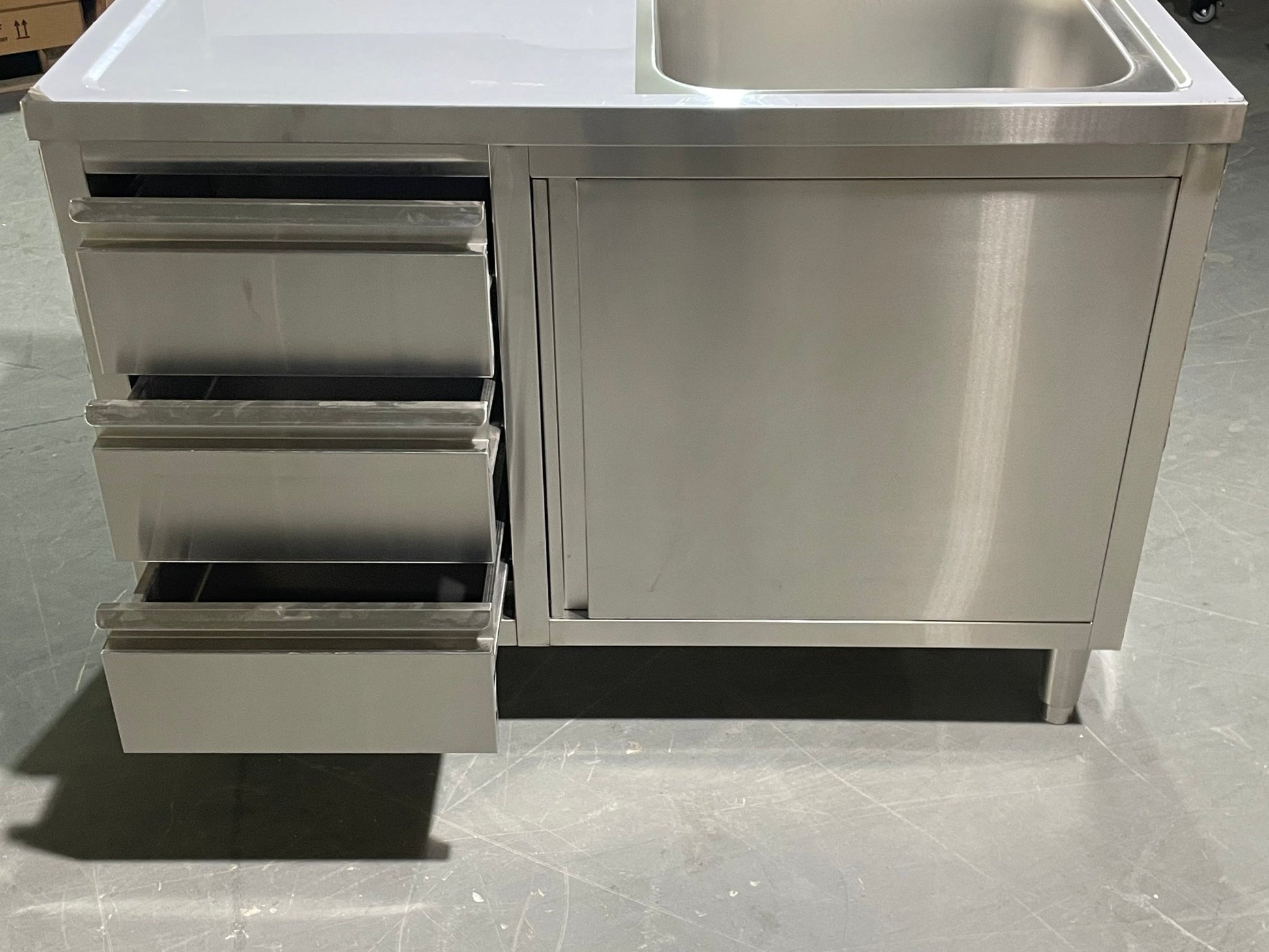 Stainless steel utility sink with 3 drawers front view

Commercial sink cabinet for restaurant or kitchen use

Stainless sink station with pull-out storage drawers

Industrial-grade sink unit with integrated storage

Compact kitchen sink workstation for food prep areas