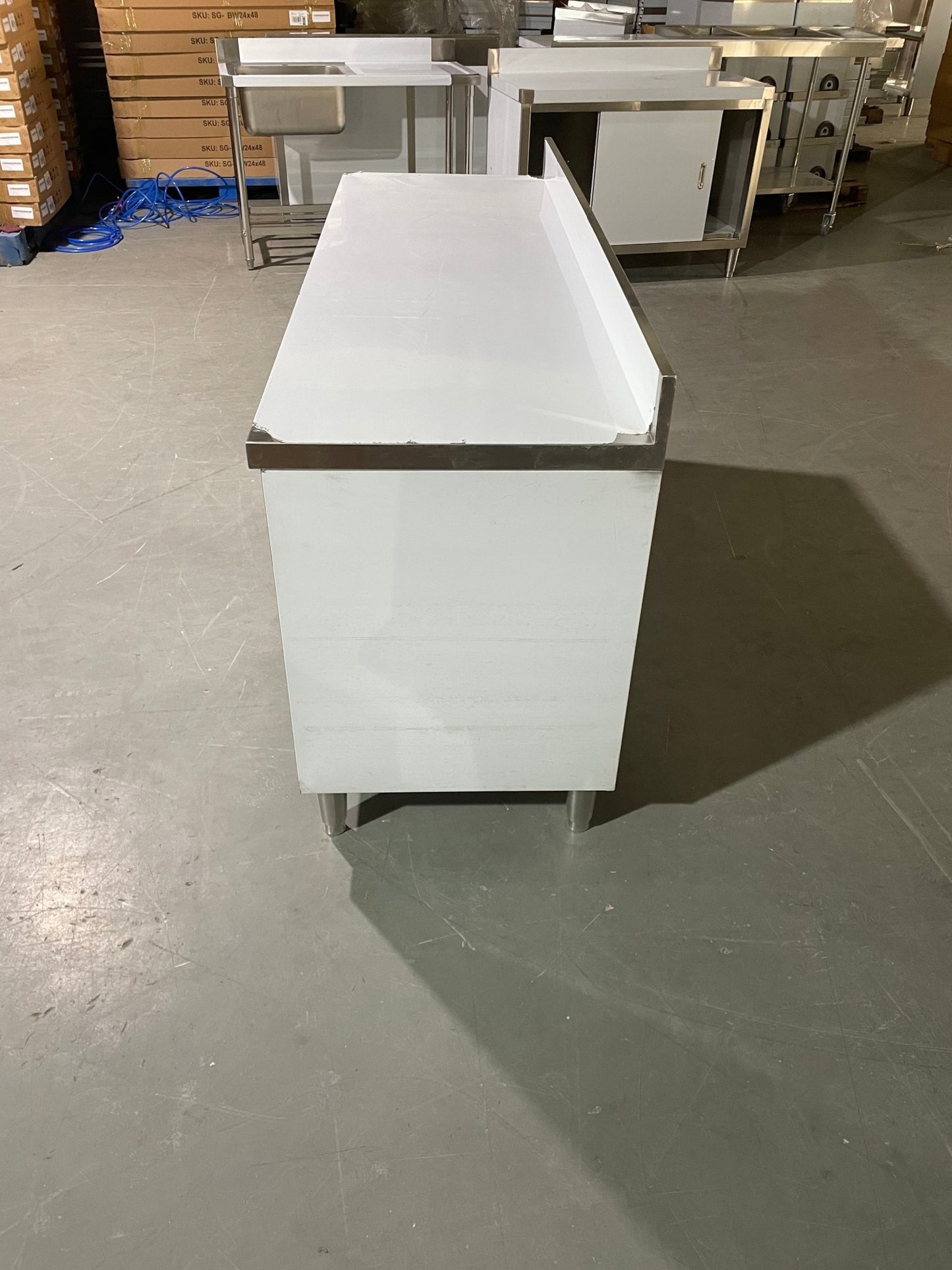 Stainless steel workbench with sliding doors front view

Restaurant prep table with built-in storage

Commercial kitchen stainless steel workbench

Side view of sliding door stainless work table

Heavy-duty garage workbench with stainless cabinet