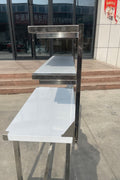 Stainless steel prep table with integrated overshelf – front view

Commercial-grade kitchen work table with upper storage

1200mm stainless prep station with dual-tier design

Heavy-duty stainless kitchen table – side angle

Restaurant overshelf prep table – silver finish

