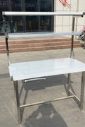 Stainless steel prep table with integrated overshelf – front view

Commercial-grade kitchen work table with upper storage

1200mm stainless prep station with dual-tier design

Heavy-duty stainless kitchen table – side angle

Restaurant overshelf prep table – silver finish

