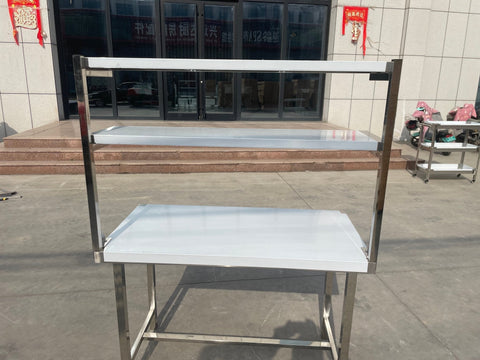 Stainless steel prep table with integrated overshelf – front view

Commercial-grade kitchen work table with upper storage

1200mm stainless prep station with dual-tier design

Heavy-duty stainless kitchen table – side angle

Restaurant overshelf prep table – silver finish

