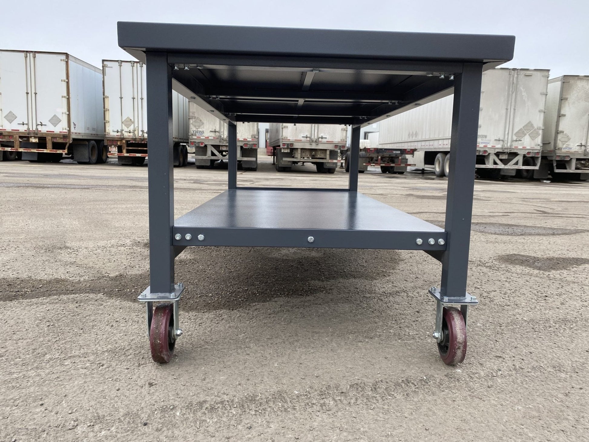 Steel Rolling Tool Table with Two Layers and Locking Casters – TC025M

Mobile Workbench with Gray Finish in Garage Setup

Heavy-Duty 2-Tier Steel Workstation for Industrial Use

Tool Table with Smooth-Rolling Wheels and Shelf Storage

Front Angle of Steel Workbench with Lower Shelf and Locking Wheels

Industrial Workshop Setup Featuring TC025M Rolling Bench

Side View of Assembled Rolling Work Table in Gray Metal