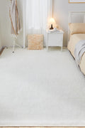 White fluffy area rug in modern living room

Gray soft rug under coffee table in cozy interior

Close-up of rug texture and anti-skid bottom

Hand touching plush surface of bedroom rug

Stylish white rug under sofa set with natural light