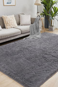 White fluffy area rug in modern living room

Gray soft rug under coffee table in cozy interior

Close-up of rug texture and anti-skid bottom

Hand touching plush surface of bedroom rug

Stylish white rug under sofa set with natural light
