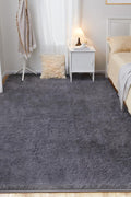 White fluffy area rug in modern living room

Gray soft rug under coffee table in cozy interior

Close-up of rug texture and anti-skid bottom

Hand touching plush surface of bedroom rug

Stylish white rug under sofa set with natural light