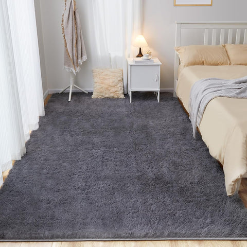 White fluffy area rug in modern living room

Gray soft rug under coffee table in cozy interior

Close-up of rug texture and anti-skid bottom

Hand touching plush surface of bedroom rug

Stylish white rug under sofa set with natural light