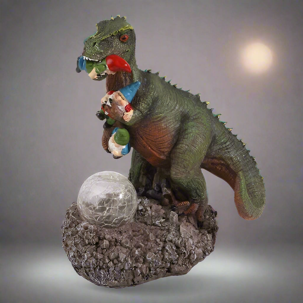 Funny dinosaur garden gnome massacre solar LED light
T-Rex devouring gnomes solar statue for garden decor
Outdoor dinosaur light with solar-powered LED illumination