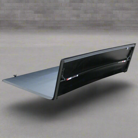 Tonneau cover folded on Ford F-250 bed
Tri-fold soft tonneau cover fully closed
Tonneau cover side view showing vinyl texture
Ford truck with tonneau cover installed – 8 ft bed
Tonneau cover folded up for easy bed access