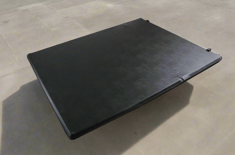 Tonneau cover folded on Ford F-250 bed
Tri-fold soft tonneau cover fully closed
Tonneau cover side view showing vinyl texture
Ford truck with tonneau cover installed – 8 ft bed
Tonneau cover folded up for easy bed access