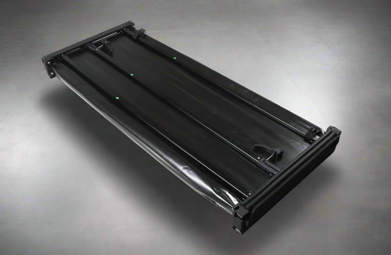 Tri-fold soft tonneau cover installed on Ford F-150 6.5 ft bed
Roll-up tonneau cover for 2009–2020 Ford truck bed
Weatherproof vinyl truck bed cover with clamp system
Tonneau cover folded up showing bed access
Side view of tri-fold tonneau cover on Ford F-150