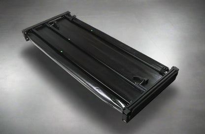 Tri-fold soft tonneau cover installed on Ford F-150 6.5 ft bed
Roll-up tonneau cover for 2009–2020 Ford truck bed
Weatherproof vinyl truck bed cover with clamp system
Tonneau cover folded up showing bed access
Side view of tri-fold tonneau cover on Ford F-150
