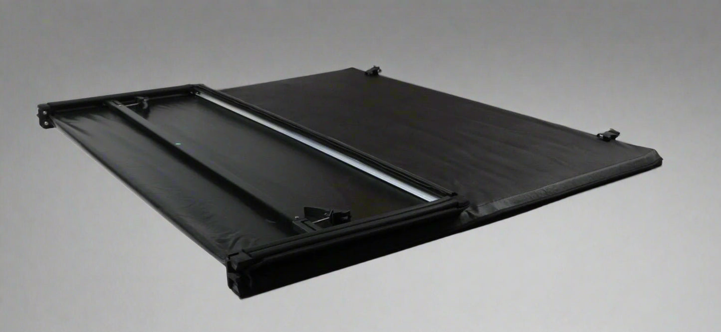 Tri-fold soft tonneau cover installed on Ford F-150 6.5 ft bed
Roll-up tonneau cover for 2009–2020 Ford truck bed
Weatherproof vinyl truck bed cover with clamp system
Tonneau cover folded up showing bed access
Side view of tri-fold tonneau cover on Ford F-150