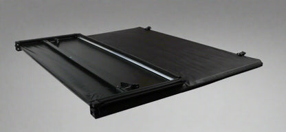 Tri-fold soft tonneau cover installed on Ford F-150 6.5 ft bed
Roll-up tonneau cover for 2009–2020 Ford truck bed
Weatherproof vinyl truck bed cover with clamp system
Tonneau cover folded up showing bed access
Side view of tri-fold tonneau cover on Ford F-150