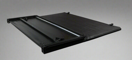 Tri-fold soft tonneau cover installed on Ford F-150 6.5 ft bed
Roll-up tonneau cover for 2009–2020 Ford truck bed
Weatherproof vinyl truck bed cover with clamp system
Tonneau cover folded up showing bed access
Side view of tri-fold tonneau cover on Ford F-150