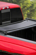 Tri-fold soft tonneau cover installed on Ford F-150 6.5 ft bed
Roll-up tonneau cover for 2009–2020 Ford truck bed
Weatherproof vinyl truck bed cover with clamp system
Tonneau cover folded up showing bed access
Side view of tri-fold tonneau cover on Ford F-150