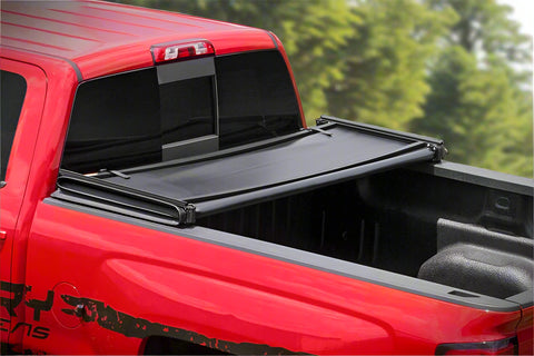 Tri-fold soft tonneau cover installed on Ford F-150 6.5 ft bed
Roll-up tonneau cover for 2009–2020 Ford truck bed
Weatherproof vinyl truck bed cover with clamp system
Tonneau cover folded up showing bed access
Side view of tri-fold tonneau cover on Ford F-150