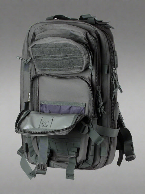 Tracker Tactical Backpack in OD Green – military style with compartments
Side view of tactical backpack with breathable straps and buckles
Tactical backpack opened to show internal pockets and zippers
Outdoor survival backpack with molle system and storage pockets