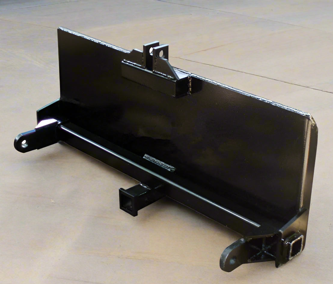 HLA67 skid steer to 3-point hitch plate – front angle
Rear view of 3-point skid steer adapter with lift arms
Close-up of 2" trailer receiver hitch on adapter plate
Side profile of Category 1 & 2 compatible plate
Adjustable lift arms and steel plate design