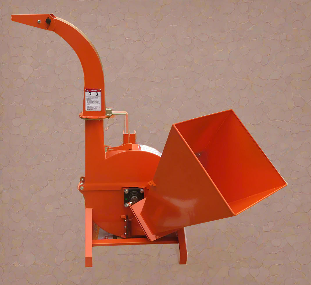 Front view of BX42T 3-point wood chipper attachment

Side profile showing 25" chipping disk on BX42T

Close-up of chipper blades and discharge chute

BX42T wood chipper connected to tractor PTO