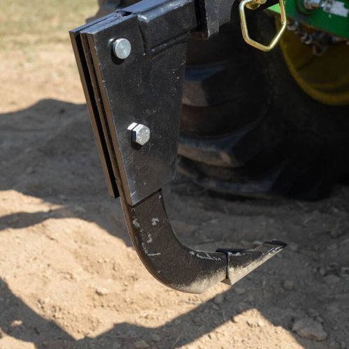 Heavy-duty 3-point hitch mounted ripper – side view

Tractor with ripper attachment trenching in soil

Ripper attachment digging through compacted ground