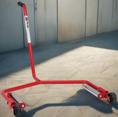 Red truck tire changing dolly with heavy-duty steel frame and caster wheels

