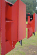 Red tree and fence post puller attachment for skid steer
Side view of HLA95 quick attach post puller
Close-up of welded frame and mounting plate
Top view of post puller showing jaw spacing
Tree and post puller connected to tractor