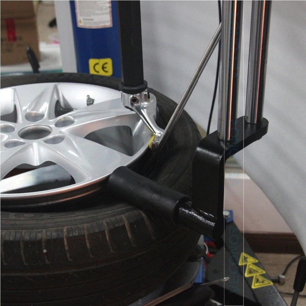 Universal helper arm for tire changer machines – TCHP21
Mountable tire changer arm with roller and guide
Professional tire changer helper arm installed on machine
TCHP21 accessory arm for semi-automatic tire changers