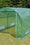 Walk-in dome greenhouse in backyard garden – 20x10x7 size

Peak roof tunnel greenhouse with open flap – front angle

Side view of large greenhouse with roll-up windows

Walk-in greenhouse with anchoring on grass lawn

All-weather plastic greenhouse with steel frame