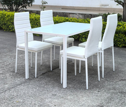 White glass dining table set with 4 chairs in the bright kitchen
Close-up of white glass table and upholstered chair
Side angle of a full 5-piece dining set
White dining chairs around a modern glass table
Dining set outdoors showing full product design