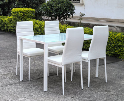 White glass dining table set with 4 chairs in the bright kitchen
Close-up of white glass table and upholstered chair
Side angle of a full 5-piece dining set
White dining chairs around a modern glass table
Dining set outdoors showing full product design