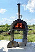 Full pizza oven on patio with wood and gas tank connected