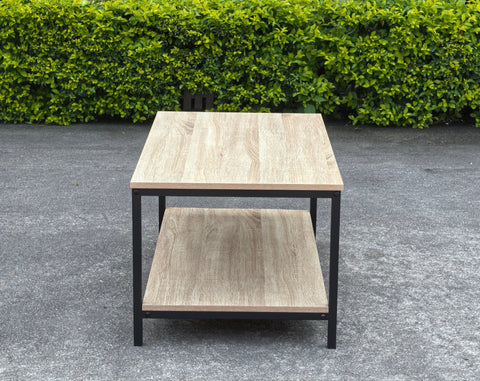 Minimalist wood grain coffee table in a living room setting
Side view of coffee table with black metal frame
Open shelf coffee table for modern homes
Neutral-toned coffee table with sturdy build
Lifestyle photo of coa ffee table with décor accessories