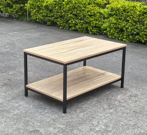 Minimalist wood grain coffee table in a living room setting
Side view of coffee table with black metal frame
Open shelf coffee table for modern homes
Neutral-toned coffee table with sturdy build
Lifestyle photo of coa ffee table with décor accessories