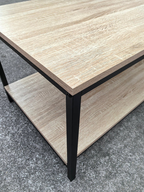 Minimalist wood grain coffee table in a living room setting
Side view of coffee table with black metal frame
Open shelf coffee table for modern homes
Neutral-toned coffee table with sturdy build
Lifestyle photo of coa ffee table with décor accessories