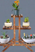 Wooden 3-tier plant stand with brown finish for indoor outdoor use

Rustic vertical flower shelf with pinewood construction

Multi-level wooden plant holder for patio or balcony display

Tiered plant display stand with decorative potted flowers

Compact and stylish garden plant rack made of wood