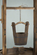 Rustic wooden wishing well planter for outdoor garden

Bucket planter for backyard flowers and herbs

Decorative fir wood flower pot with roof

Weather-resistant outdoor planter for lawn

Vintage-style wooden flower planter with rope bucket

