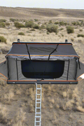 X3 rooftop tent fully opened with ladder
Closed X3 hard shell rooftop tent on SUV
Interior view of X3 rooftop tent
Overland-ready rooftop tent with LED lighting
Rooftop camping shelter mounted on vehicle