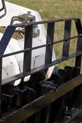 XL pallet fork frame with 2-inch receiver for skid steer – 5000 lb rated
Heavy-duty 72-inch skid steer pallet fork frame with headache rack
Skid steer fork frame in field with trailer hitch and fork slots
Compact 60" pallet fork frame – skid steer attachment
Slotted carriage for Class II pallet forks on steel frame