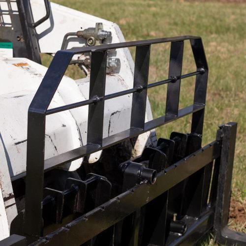 XL pallet fork frame with 2-inch receiver for skid steer – 5000 lb rated
Heavy-duty 72-inch skid steer pallet fork frame with headache rack
Skid steer fork frame in field with trailer hitch and fork slots
Compact 60" pallet fork frame – skid steer attachment
Slotted carriage for Class II pallet forks on steel frame