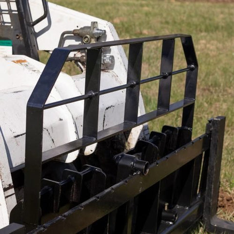 XL pallet fork frame with 2-inch receiver for skid steer – 5000 lb rated
Heavy-duty 72-inch skid steer pallet fork frame with headache rack
Skid steer fork frame in field with trailer hitch and fork slots
Compact 60" pallet fork frame – skid steer attachment
Slotted carriage for Class II pallet forks on steel frame