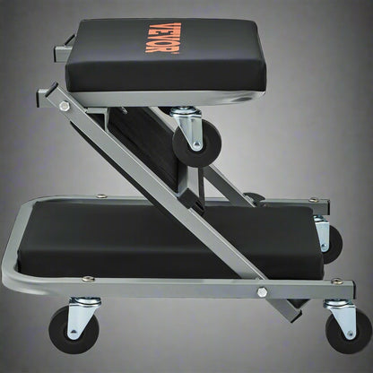 “Folding mechanic creeper seat with wheels and padding”

“2-in-1 creeper and stool in folded position”

“Padded garage creeper stool with Z-frame design”

“Mechanic rolling seat used under car in garage”

“Close-up of caster wheels and vinyl seat cushion”