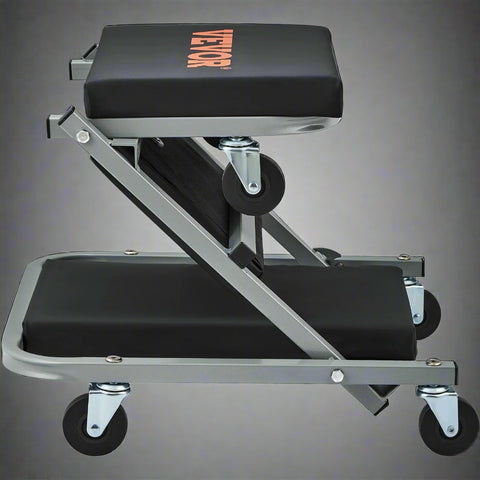 “Folding mechanic creeper seat with wheels and padding”

“2-in-1 creeper and stool in folded position”

“Padded garage creeper stool with Z-frame design”

“Mechanic rolling seat used under car in garage”

“Close-up of caster wheels and vinyl seat cushion”