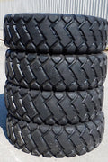 Heavy-duty E-3/L3 bias ply loader tire on warehouse floor

Rock lug pattern close-up for traction

20.5-25 loader tire tread and sidewall view

Mining OTR tire mounted on equipment

Rugged loader tire for industrial applications