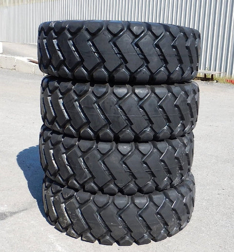 Heavy-duty E-3/L3 bias ply loader tire on warehouse floor

Rock lug pattern close-up for traction

20.5-25 loader tire tread and sidewall view

Mining OTR tire mounted on equipment

Rugged loader tire for industrial applications