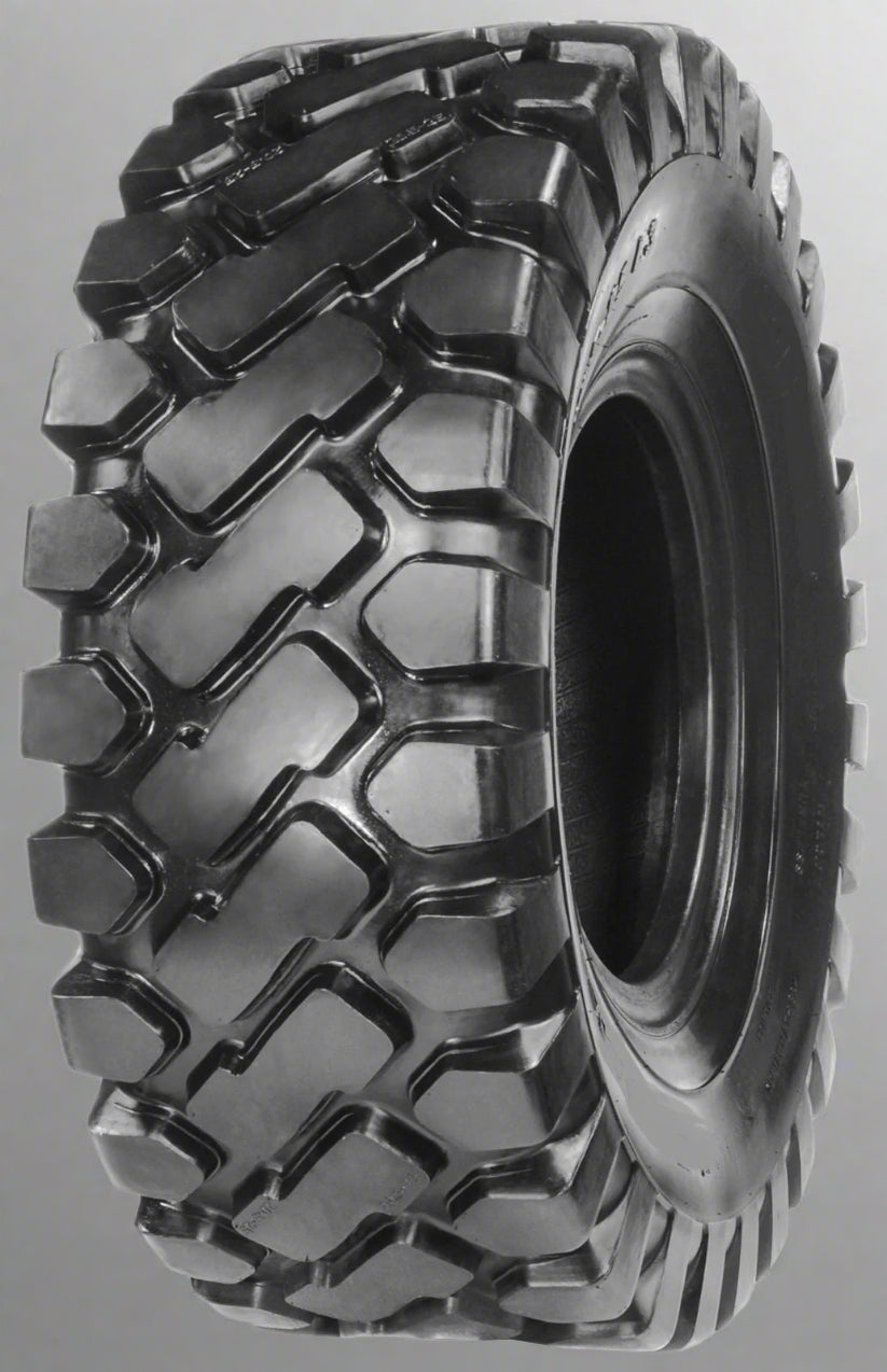 Heavy-duty E-3/L3 bias ply loader tire on warehouse floor

Rock lug pattern close-up for traction

20.5-25 loader tire tread and sidewall view

Mining OTR tire mounted on equipment

Rugged loader tire for industrial applications