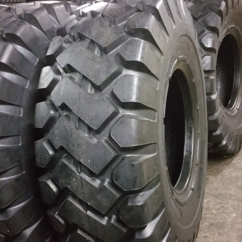 Heavy-duty E-3/L3 bias ply loader tire on warehouse floor

Rock lug pattern close-up for traction

20.5-25 loader tire tread and sidewall view

Mining OTR tire mounted on equipment

Rugged loader tire for industrial applications