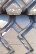 Heavy-duty E-3/L3 bias ply loader tire on warehouse floor

Rock lug pattern close-up for traction

20.5-25 loader tire tread and sidewall view

Mining OTR tire mounted on equipment

Rugged loader tire for industrial applications